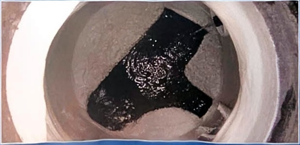 Restored manhole after composite liner rehabilitation